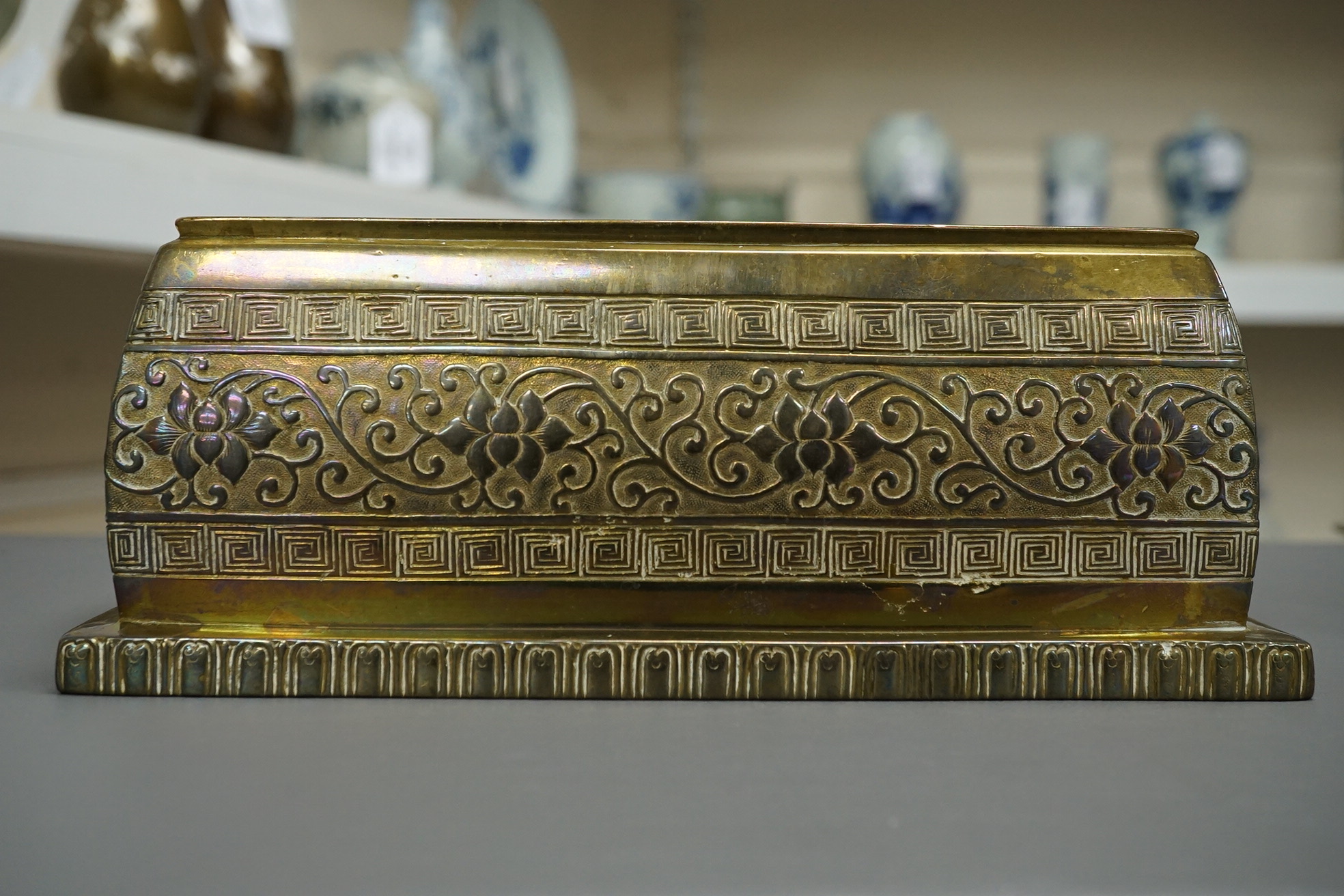 A large Chinese bronze rectangular censer and cover, Xuande seal mark, and a ‘plum blossom and chilong’ bronze censer, both 19th century
